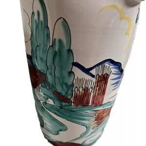 Italian pitcher from Italy with vibrant colors.  It is signed on the bottom.